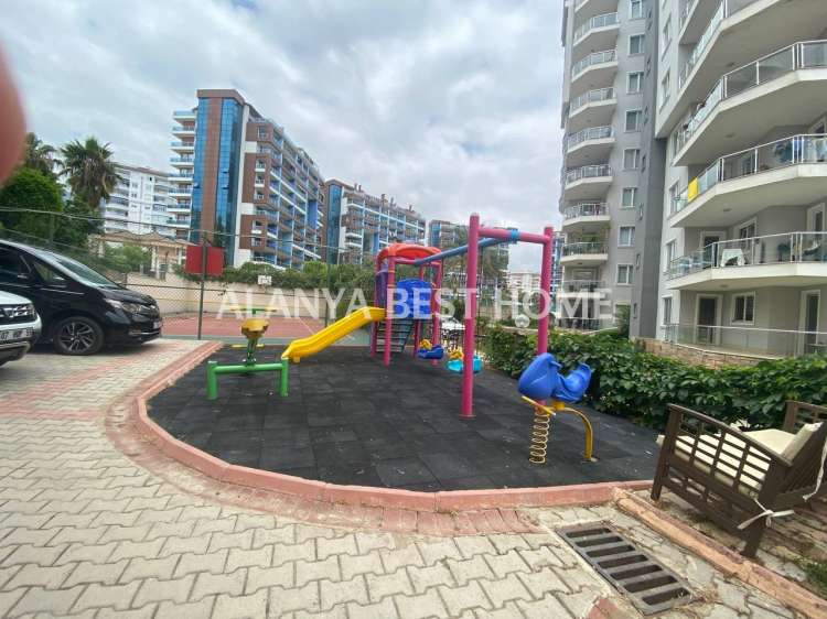CİKCİLLİ'DE AKTİVİTELİ SİTE İÇERİSİNDE DENİZ VE KALE MANZARALI 4+1 EŞYALI DUBLEKS DAİRE