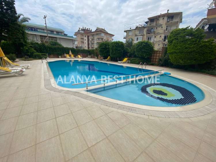 CİKCİLLİ'DE AKTİVİTELİ SİTE İÇERİSİNDE DENİZ VE KALE MANZARALI 4+1 EŞYALI DUBLEKS DAİRE